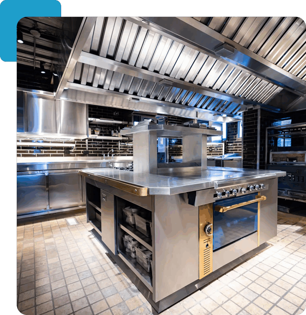 Commercial kitchen with stainless steel appliances.