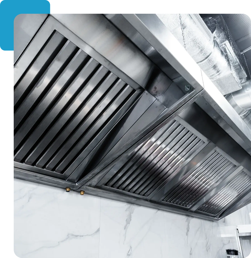 Stainless steel commercial kitchen exhaust hood.