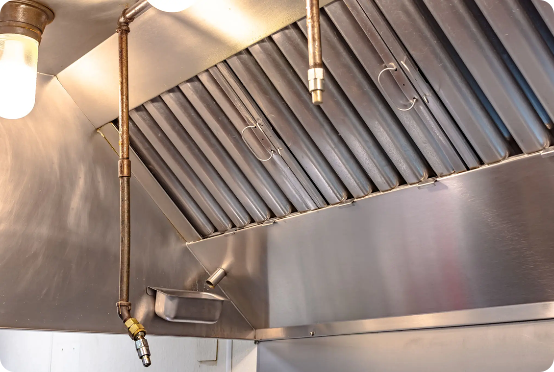 Commercial kitchen stainless steel exhaust hood.