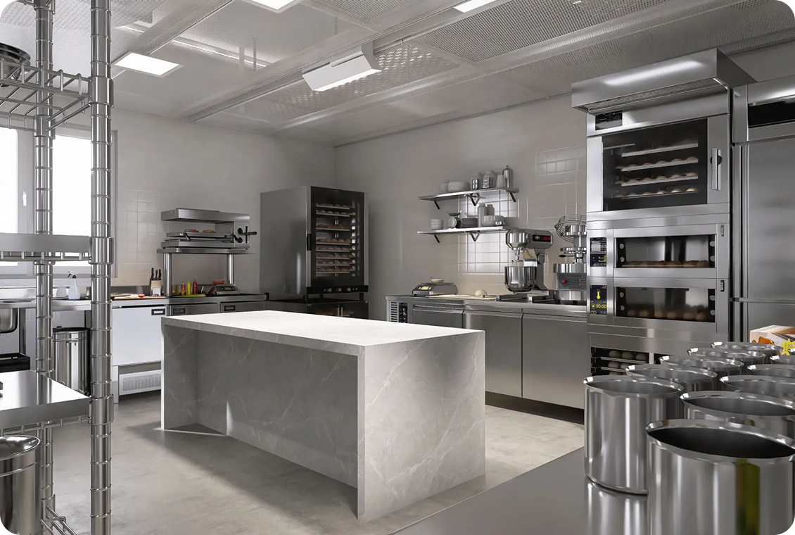 Modern industrial kitchen with stainless steel equipment.